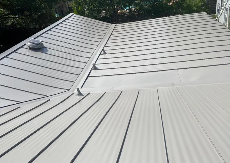 Solar attic fan installed on a metal roof for Roof Ventilation in North Fair Oaks